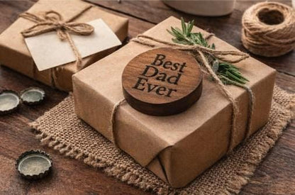 Gift wrapped in brown paper with a wooden tag saying 'Best Dad Ever' on a rustic wooden surface.